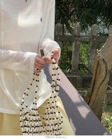 バックボタンシアートップス