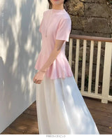 ペプラムニットトップス